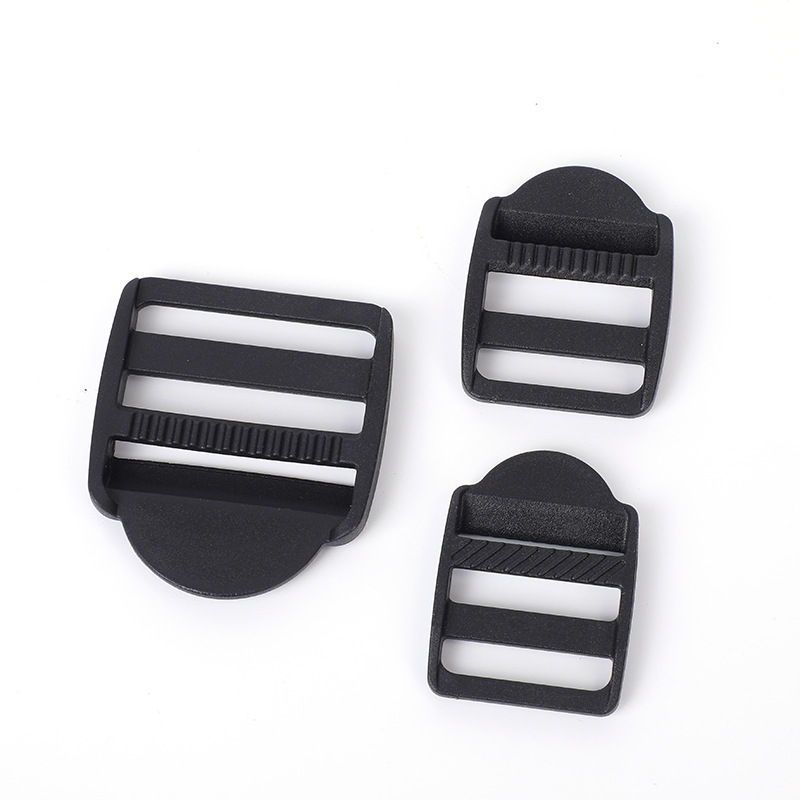 Accesorios de maleta de plástico negro trapezoidal ajustable botón POM mochila botón de botón de banda de tela plana cuatro botones