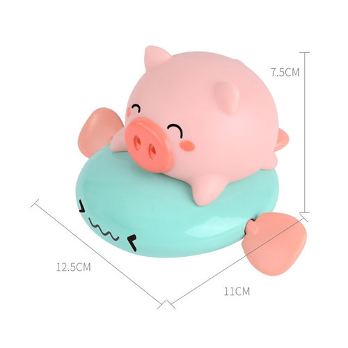 Children's wind-up piglet rides a flying fish, baby pulls a string and plays in the water, a whale dinosaur rides a flying fish, takes a bath, sprays water and swims toy