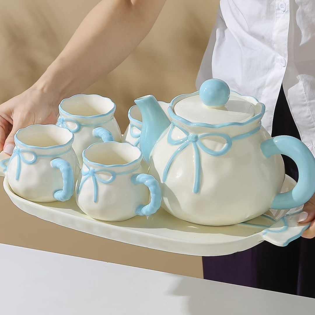 Personalidad creativa de alto valor facial arco hervidor de agua fría conjunto de tazas de cerámica acuario conjunto de nicho regalo de cumpleaños