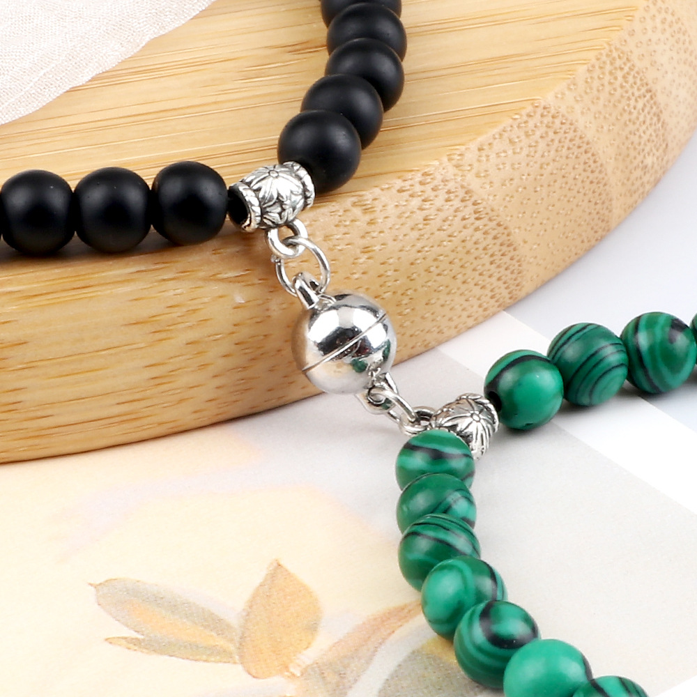 Paararmbänder ein Paar Freundinnen Perlen Nische geflochtenes Design Handseil runde Magnetschnalle Saugnapf Anhänger Armband Spot_voghion.com