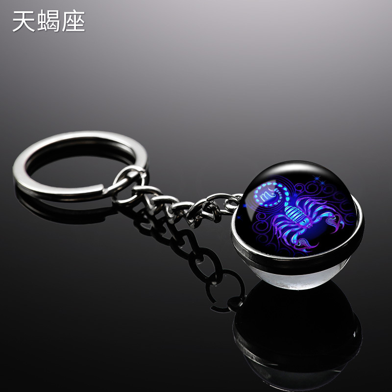 Transfronterizo 12 constelaciones de luz nocturna bolsos colgantes de bolsas de joyas de tiempo doble cara bola de vidrio llavero al por mayor