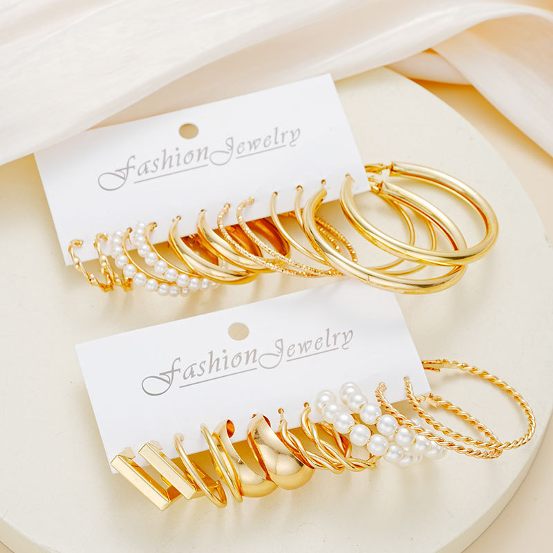 Europa y América transfronteriza nueva atmósfera creativa simple anillo de diamantes de perlas pendientes collar traje de oro al por mayor