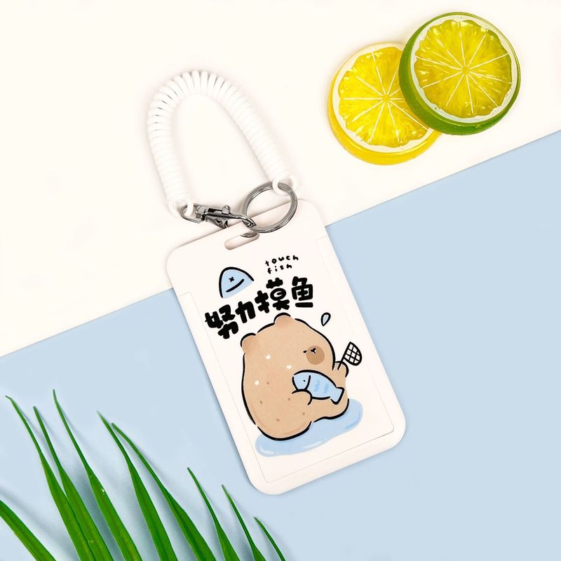 学生の漫画のカードカバーのかわいい熊の食事カードのバスの地下鉄のカードの包みはぼろぼろな文学の胸の札の保護カバーのメーカーを並べます。|undefined