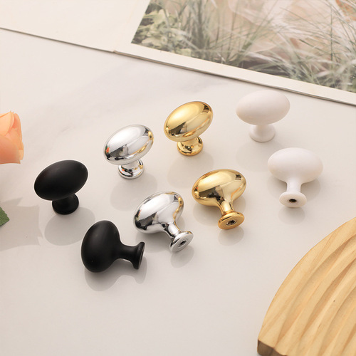 Gold French-style bedside cabinet with elliptical drawer pulls, electroplated plastic single hole handles, pigeon egg design