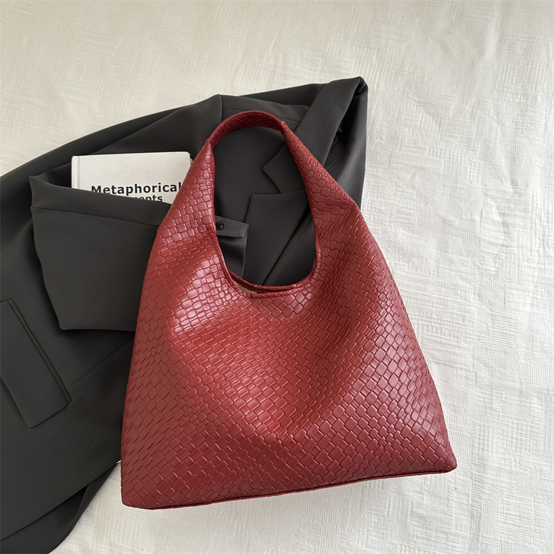 Casual diseño de gran capacidad de estilo extranjero bolso de hombro 2025 moda trenzado bolso de viaje simple retro bolso de brazo