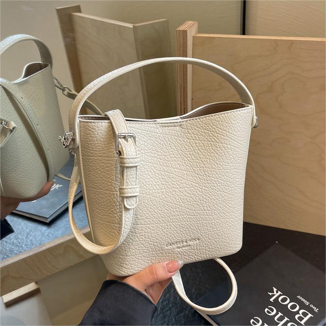 Bolsa de mano con estampado de litchi de alta calidad, dama, 2024 primavera y verano, nueva bolsa de hombro universal, diseño simple, bolsa de cubo