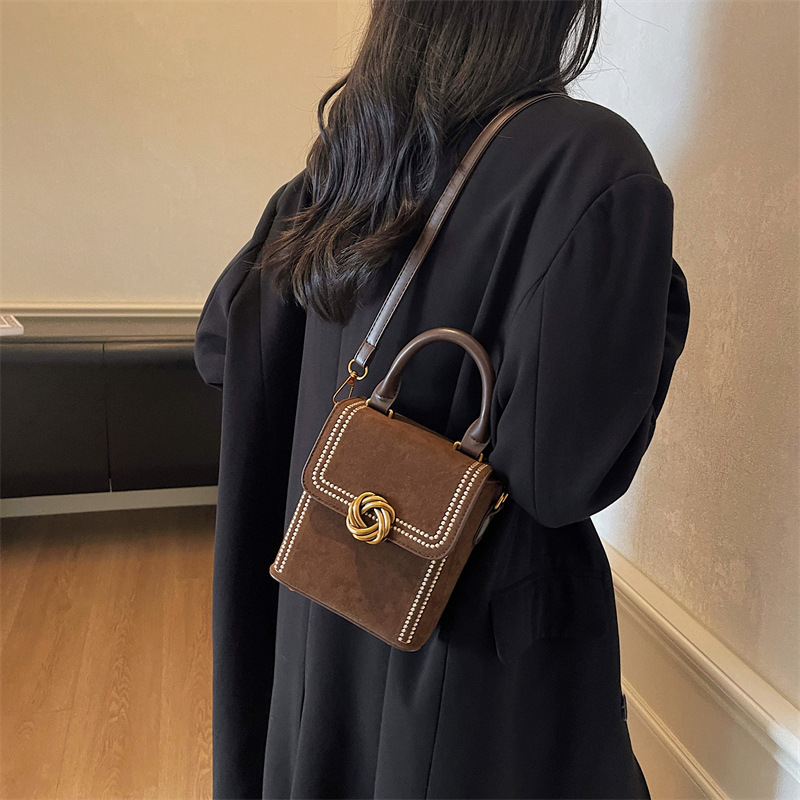 Retro alta sensación vertical bolso de mano pequeña mujer otoño / invierno 2025 nuevo estilo de moda bolso de hombro simple bolso de mochila