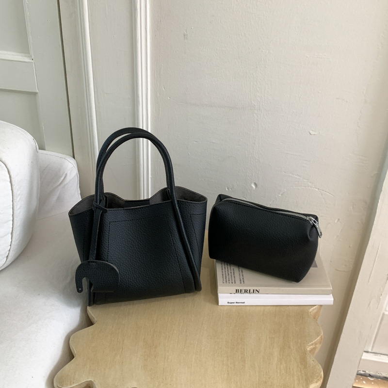 Bolso para mujeres 2026 nuevo estilo de moda bolso de cubo portátil de alta calidad lichi patrón popular lujo ligero mochila casual