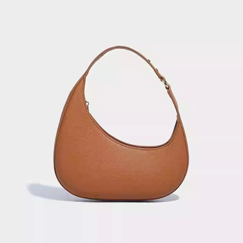 2025 nuevo diseño de nicho de moda europea y americana, bolso de luna creciente irregular en forma de media luna, bolso de axila de alta gama, mujer