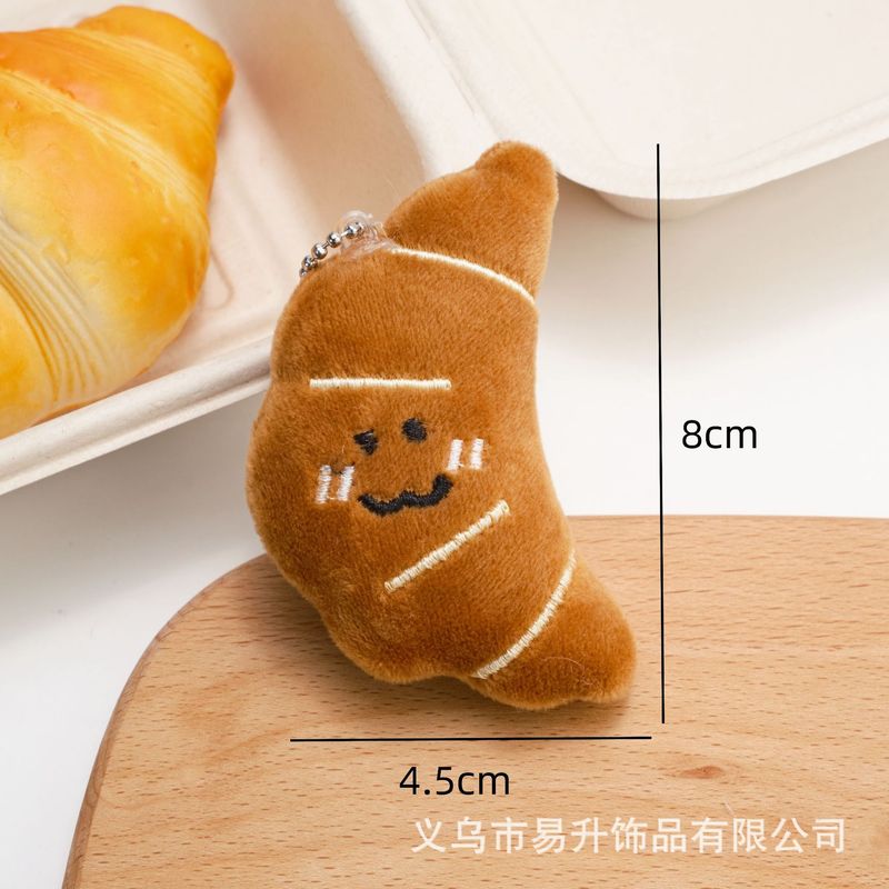 創意的な漫画の食品のぬいぐるみのペンダントの趣味は牛の角のカバンの子供の鍵を遊んでリュックサックを掛けて飾って屋台を並べて卸売りします。|undefined