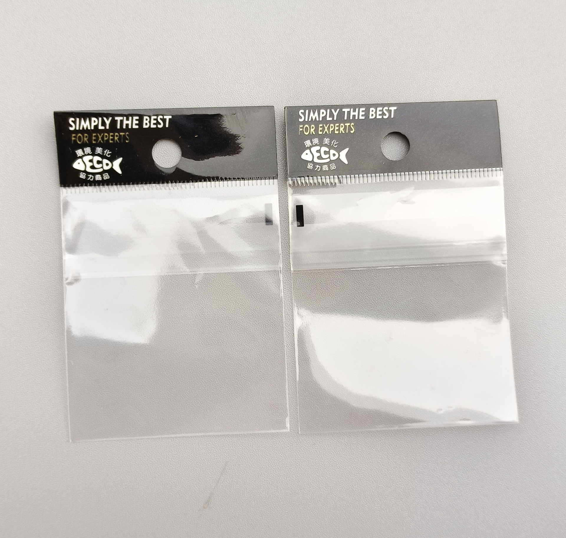 Bolsa de Embalaje Universal de accesorios pequeños en stock bolsa de joyería de plástico transparente compuesto sellado inverso ziplock bolsa al por mayor