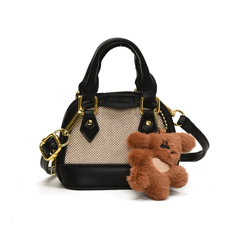 Mochila de moda de leopardo para niñas, mini bolso de concha portátil para bebés, 2025 nuevo bolso de comercio exterior para niños