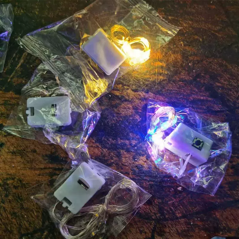 led灯串大量批发小彩灯春节铜丝纽扣电池灯圣诞装饰流行铜线灯饰