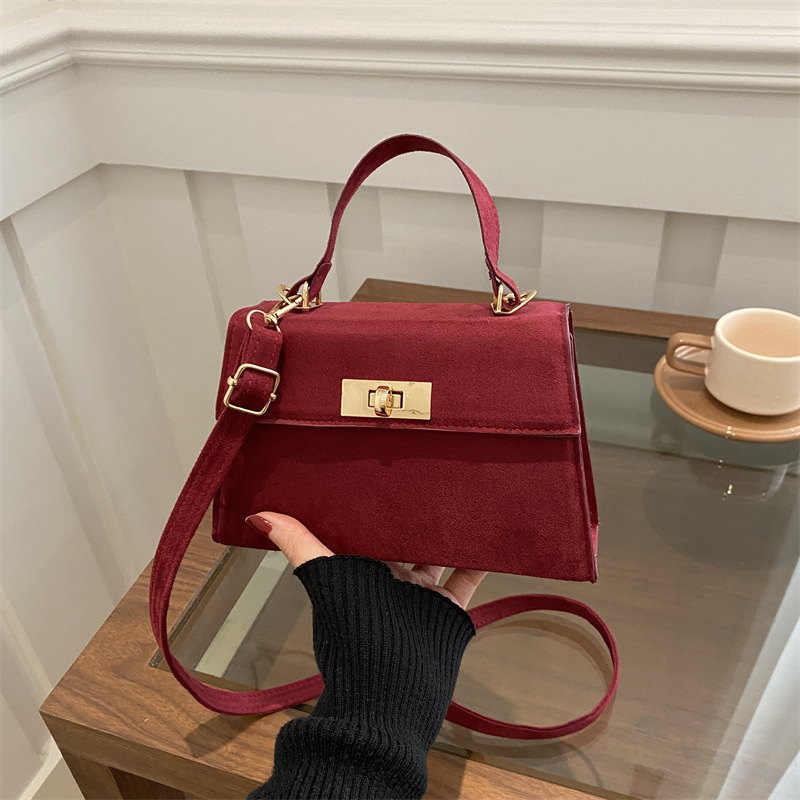 2025 primavera nueva moda simple bolso de mano de cerradura de viaje bolso de hombro retro estilo coreano bolso de mochila pequeña