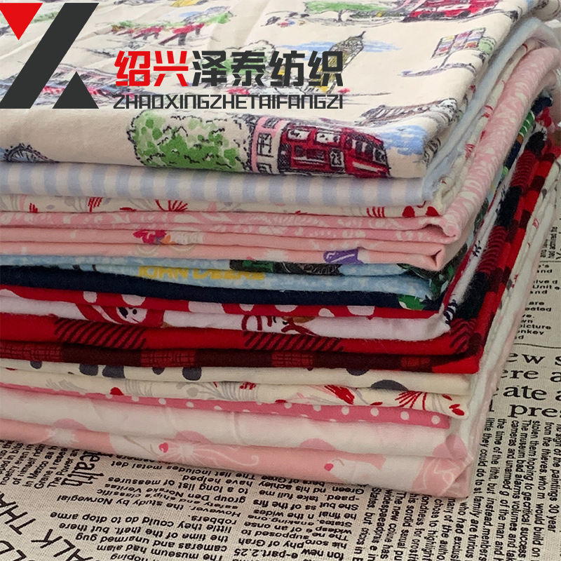 现货全棉梭织印花法兰绒 卡通印花绒布 秋冬儿童家居服睡衣料批发