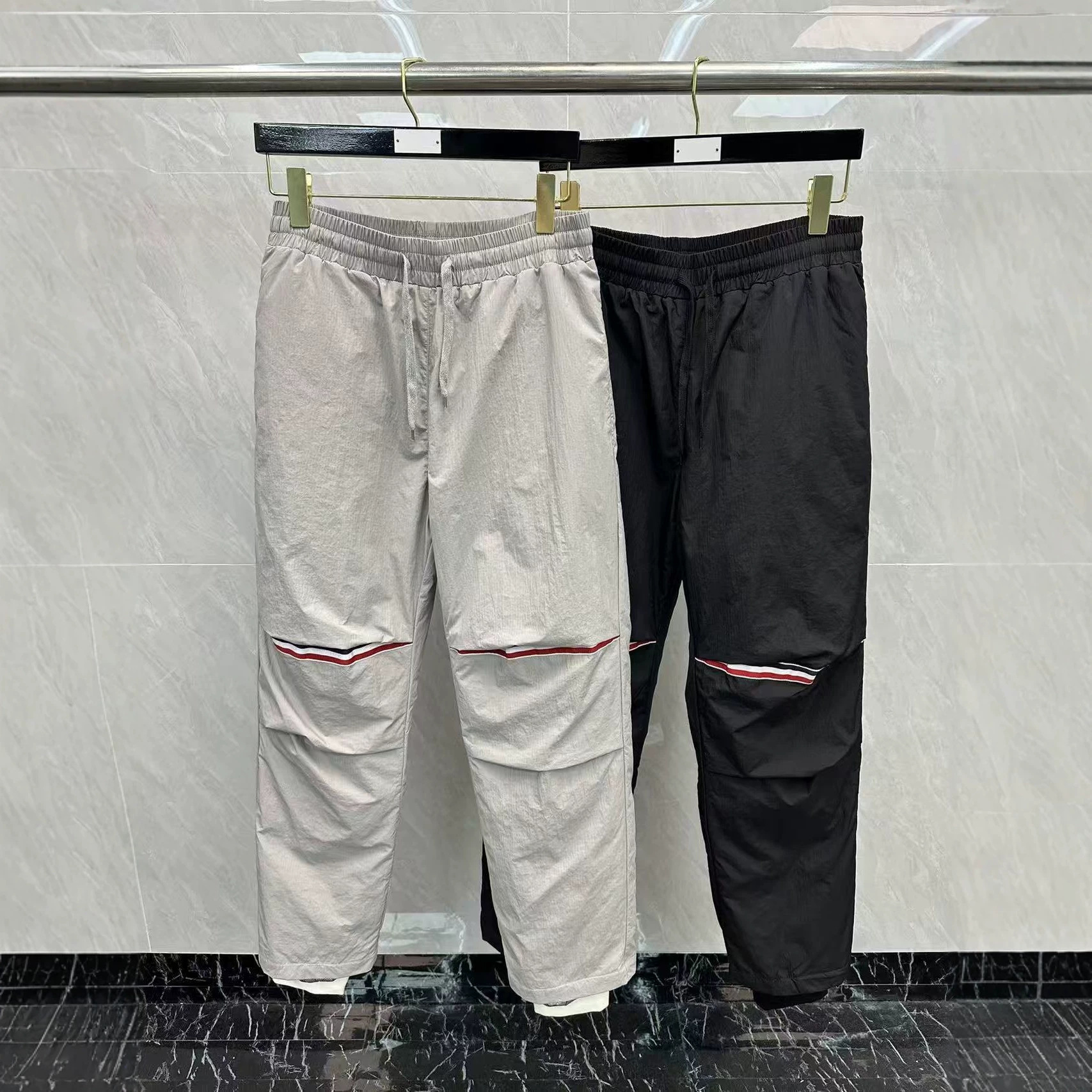 Factory direct sales of high-quality 24ssTB new autumn and winter men's casual down pants with red, white and blue jogger cuffs.