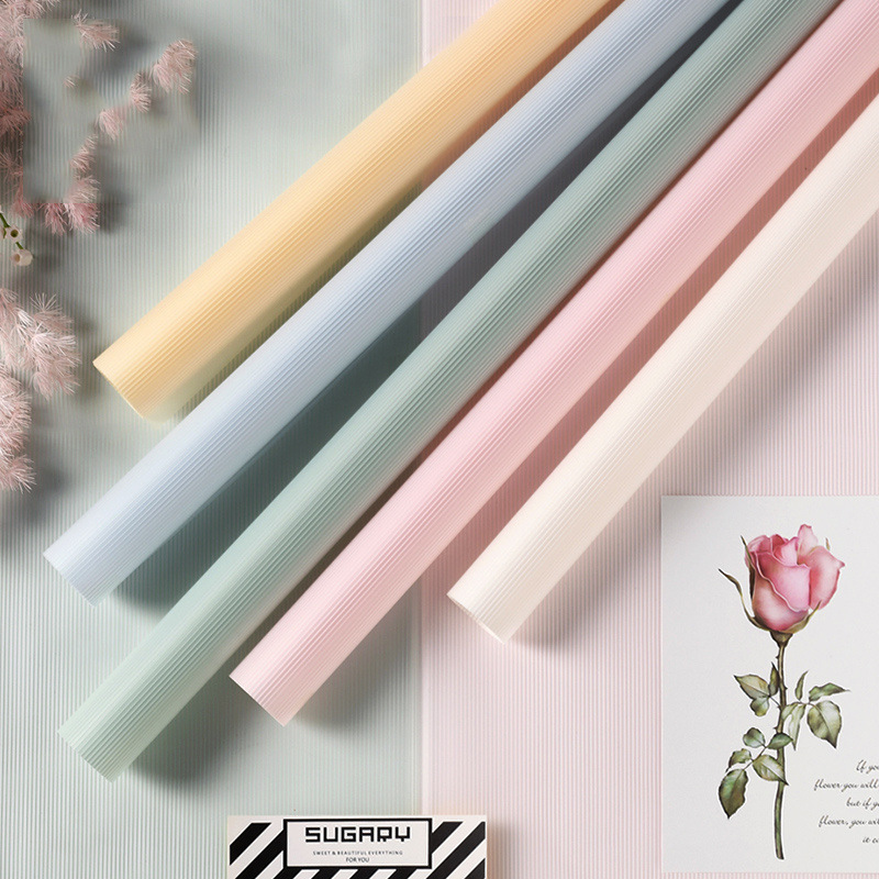 Fábrica de fiestas de flores al por mayor nueva línea de textura flor embalaje florista de color sólido papel de envoltura flor