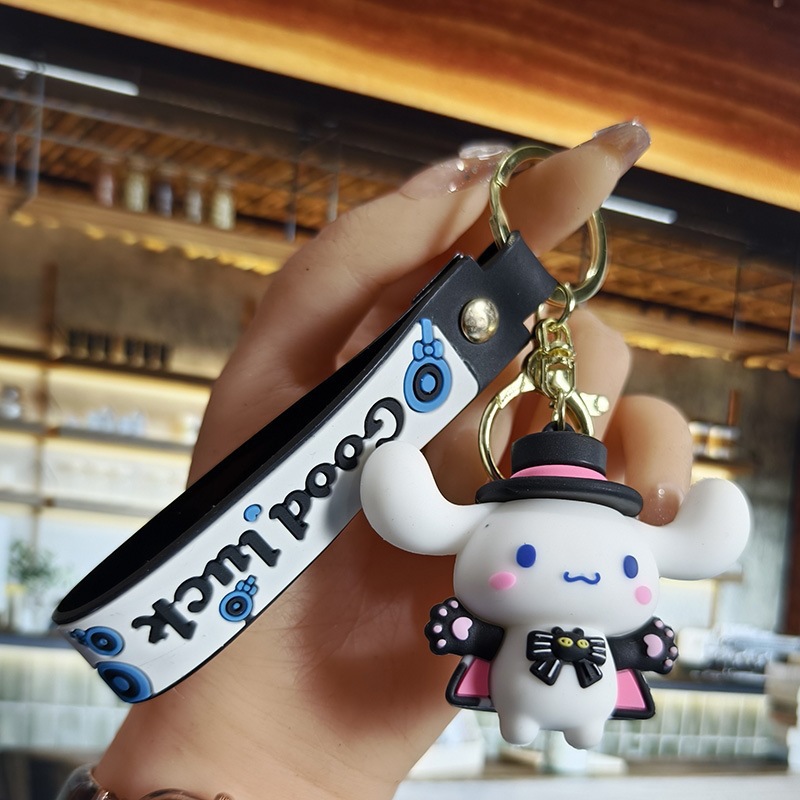 Perro de orejas grandes Melody KT gato pudín perro Kolomi caricatura de silicona llavero colgante bolsa colgante caja ciega regalo