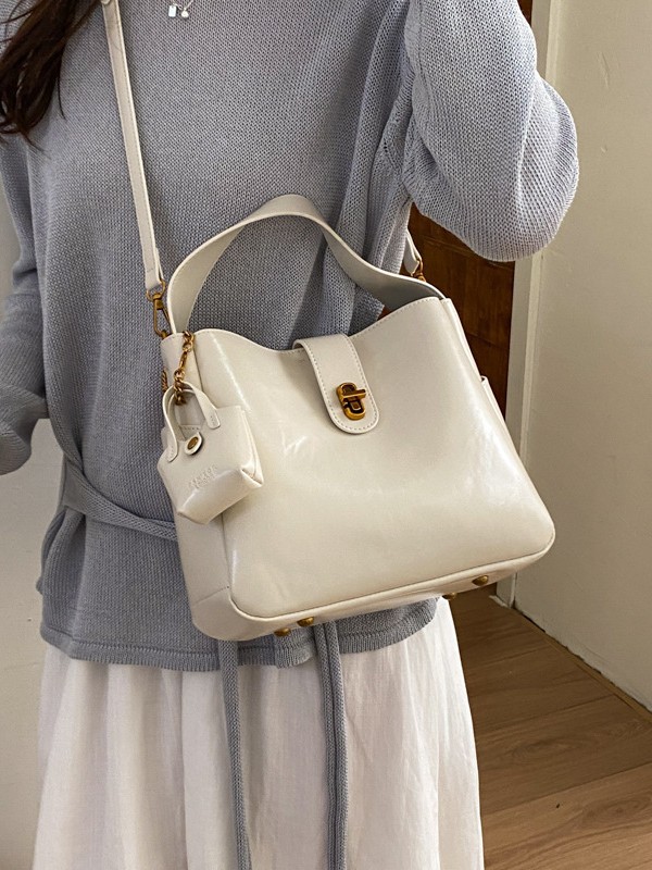 Bolsa portátil de cuero de cera retrógrada para mujeres 2026 nueva sensación de lujo ligera de alta calidad de moda versátil mochila de hombro