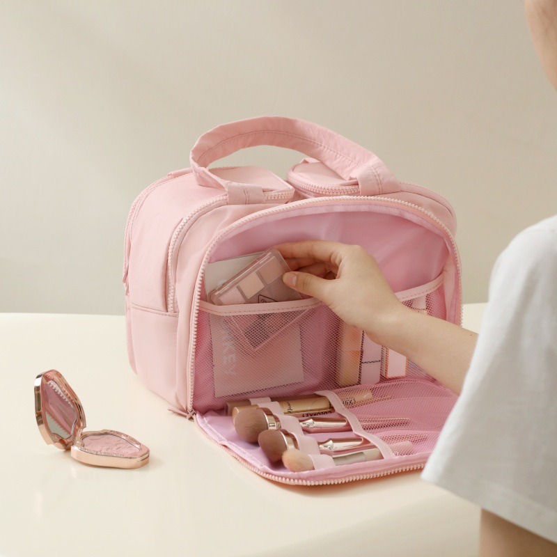 Almacenamiento de partición de bolsa de cosméticos de gran capacidad portátil pequeña y ligera mujer 2025 nueva bolsa de almacenamiento de viaje de alto valor