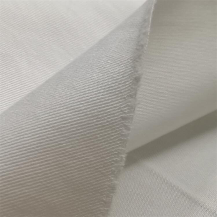 Fabricante al por mayor micro elástico tela de spandex de twill 250gsm pantalones blancos tela elástica de algodón de twill cómodo superficie de spandex