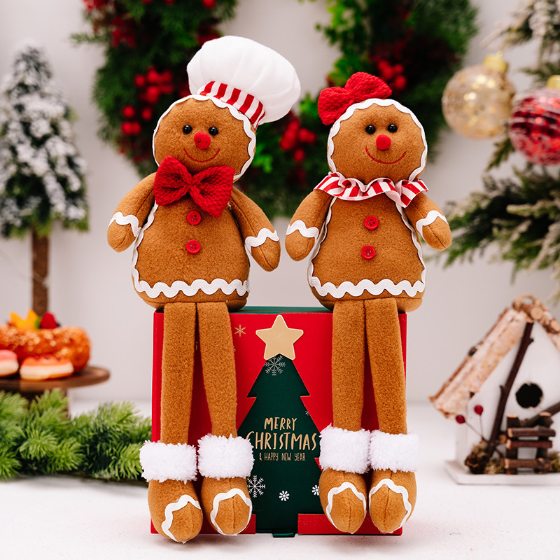 2種類のアマゾンの新しいクリスマスの姜パイ人は足の公仔のクリスマスのビスケット人を掛けてショーウインドーの雰囲気を飾っています。|undefined