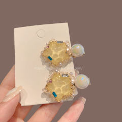 黄色の五芒星スーパー妖精ヘアピン女性のための 2025 新しいハイエンド前髪クリップ頭飾り気質夏サイドクリップ