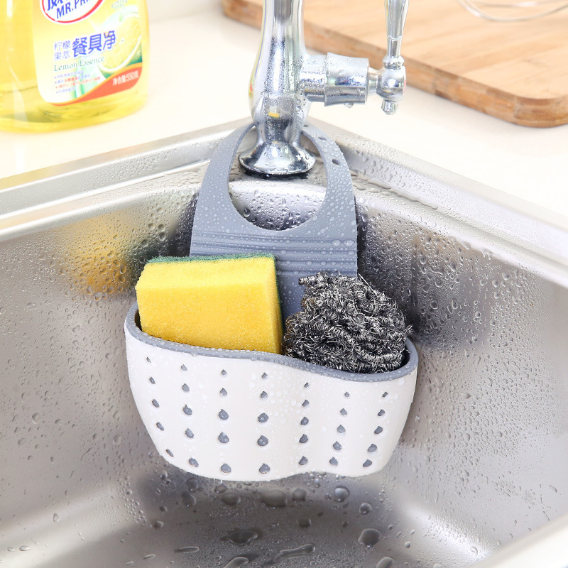 Necesidades diarias cocina drenaje cesta colgante bolsa colgante hueco para lavar platos cesta de almacenamiento de esponja cesta de almacenamiento de plástico al por mayor