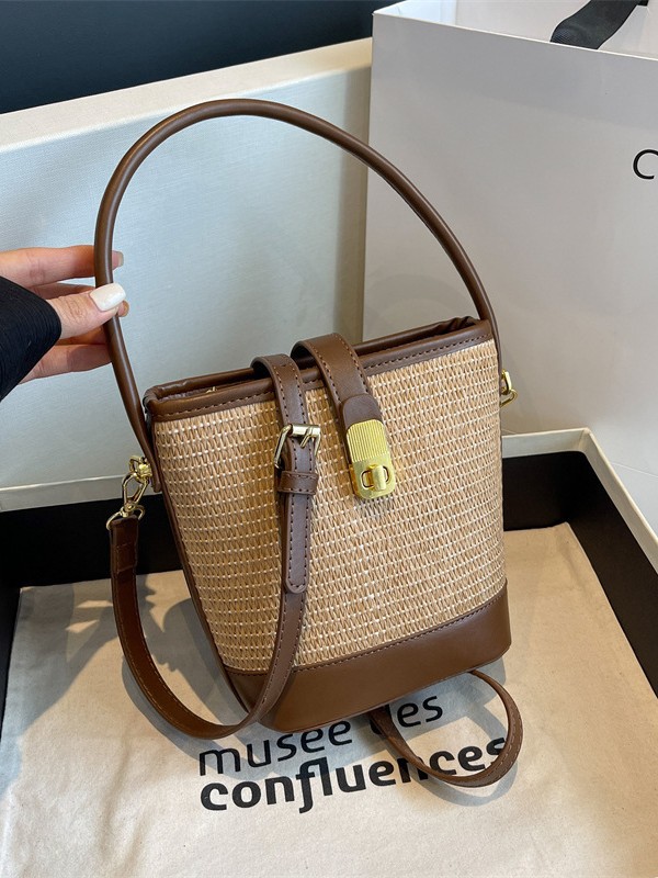 Bolso de nicho coreano bolso de cubo de tejido de mano para mujeres verano 2026 nuevo color de contraste de textura alta bolsa de mochila