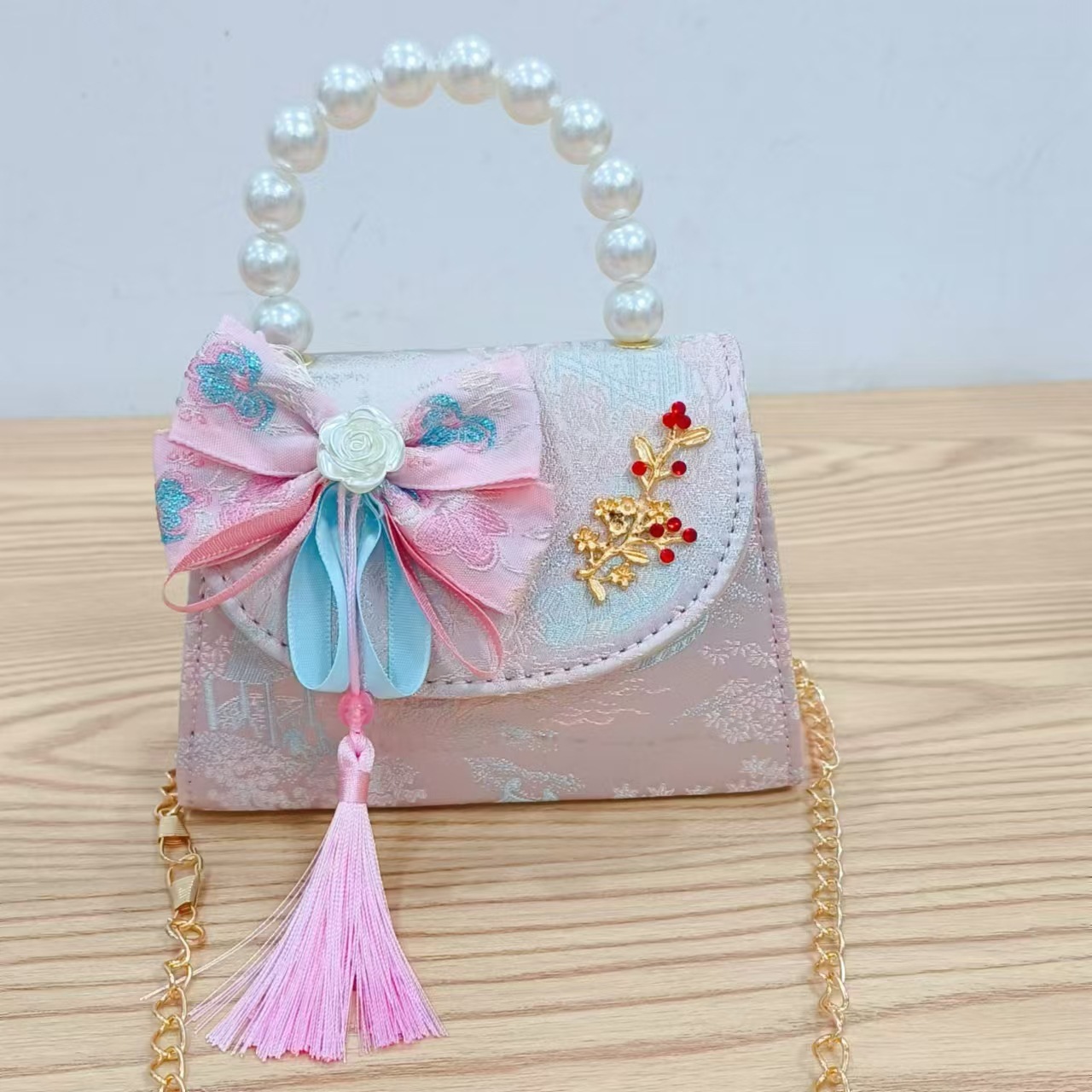 Niños pequeños bolsos de hombro de viento de fragancia de alta calidad exquisita niña antigua bolso de cambio princesa perla bolso de mano
