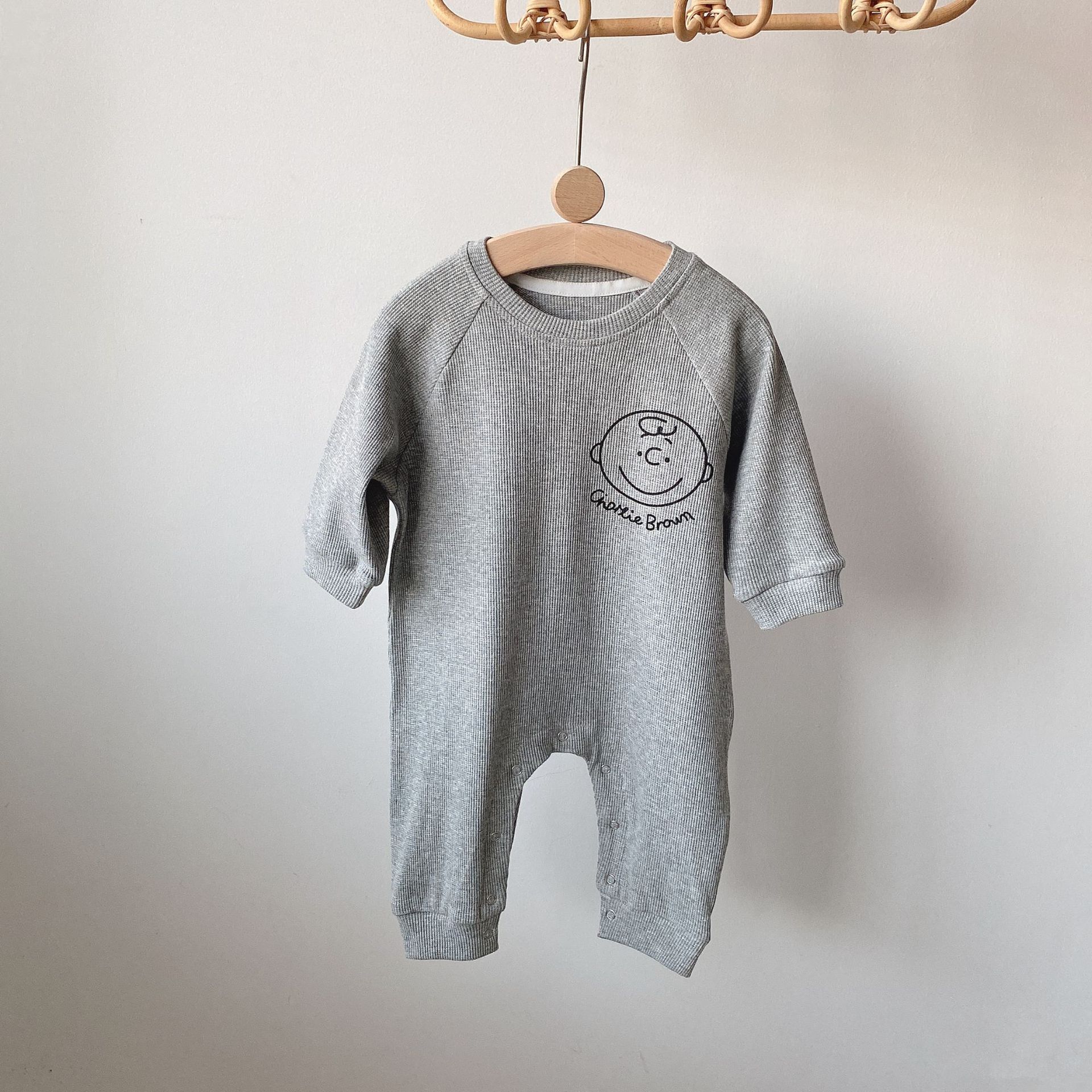 Vêtements pour enfants coréens bébé trésor automne nouveau graffiti dessin animé tête humaine pull pantalon ensemble deux pièces_voghion.com