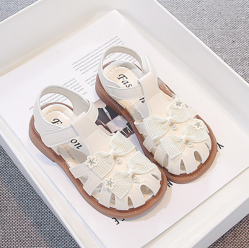 Sandallas de niñas verano 2026 nuevo estilo de moda infantil zapatos casuales versátiles arco sandalias de cabeza de bolsa zapatos princesa image 4