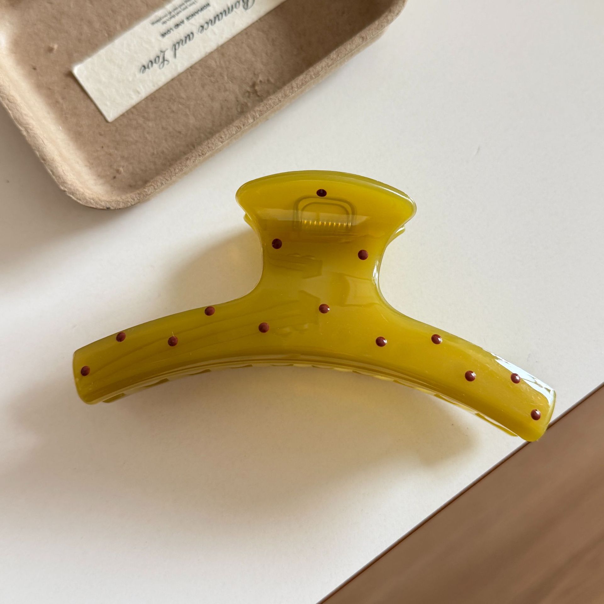 Mustard yellow polka dot clothes hanger