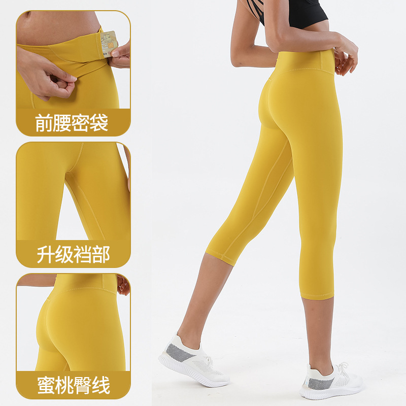 Pantalones cortos desnudos cepillados de doble cara pantalones de yoga pantalones de cintura alta de Europa y América de las mujeres de elevación de la cadera melocotón Pantalones deportivos de fitness