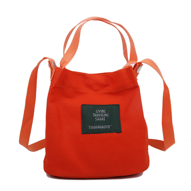 Bolso de mujer nuevo estilo coreano simple bolso de lienzo de chicas fresco de color sólido bolso de cubo de moda moda bolsa de mochila casual