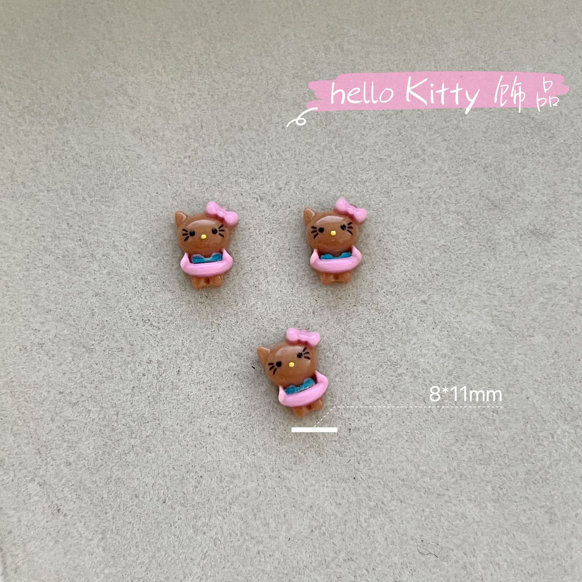 新商品のキティキャットの三麗鴎のネイルアクセサリーのネットの赤い爆発の樹脂のかわいいkt猫は甲を着て飾ります。