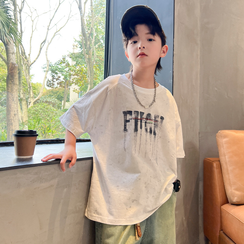 T-shirt bianca da ragazzo a maniche corte 2024 nuova maglietta per bambini estiva allentata in puro cotone alla moda_voghion.com