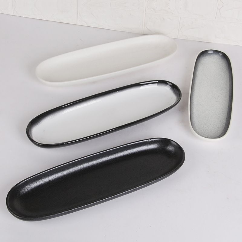 Plato de cerámica negro blanco ovalado rectangular de estilo japonés plato doméstico plato de sushi de restaurante japonés plato de ensalada plato frío