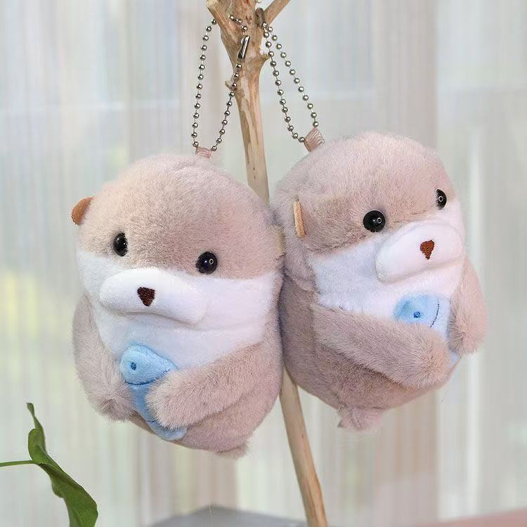 Red celebridad adorable pequeña nutria colgante juguetes de peluche muñeca animal marino bolsas colgantes muñecas llaveras muñecas