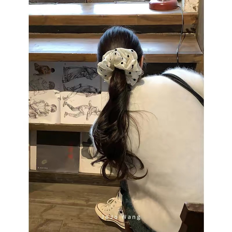 The texture is amazing! The pearlescent dots give it a classy look. This scrunchie is a stylish Korean fashion hair accessory for women