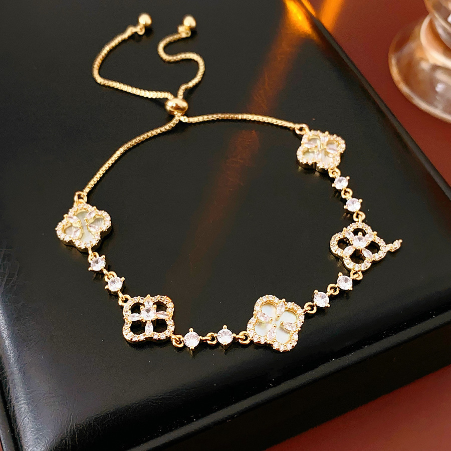 Corea del Sur cuatro pétalos de circón flor pulsera de luz de lujo de alto grado temperamento ajustable pulsera nueva pulsera al por mayor para las mujeres