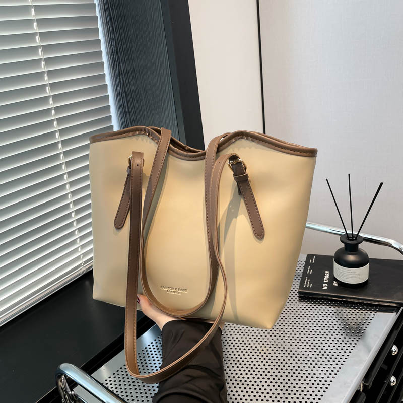 2025 primavera nueva versión coreana de la personalidad brazo bolso de mano de estilo casual simple de viaje bolso de hombro