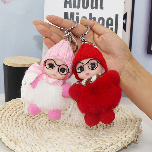 Creative keychain charm featuring a big-eyed cute kid, resembling a plush doll made of faux fur, suitable for bags and as a cartoon accessory.