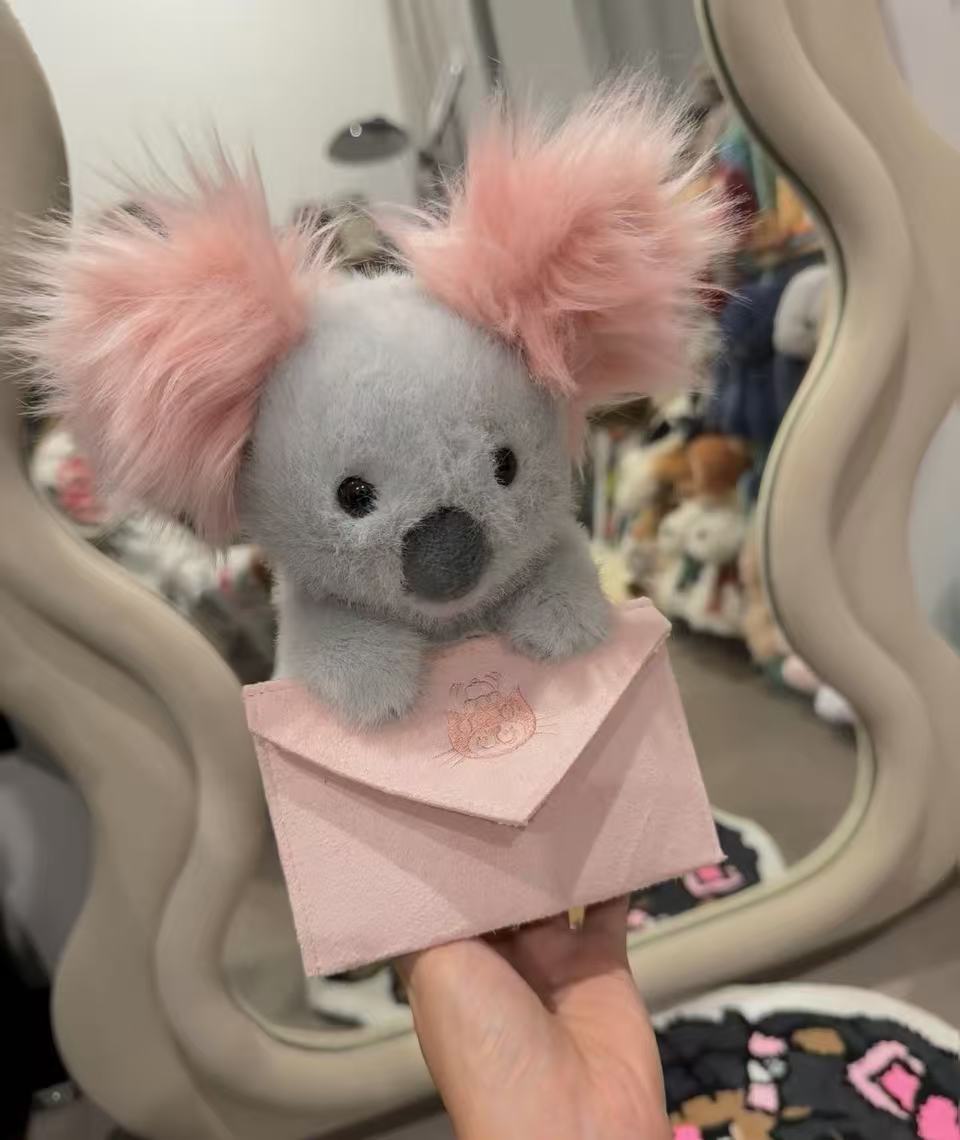 元のイギリスジェリーcatシリーズのぬいぐるみの超全合集3b斉防塵袋のバーゼル熊の手の花