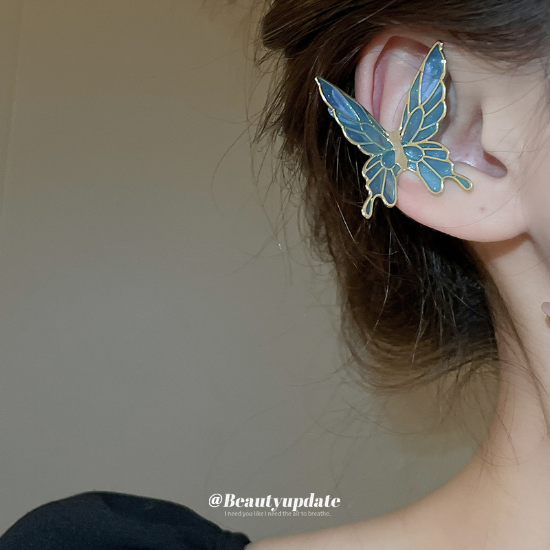 Pinzas para las orejas de aceite de goteo de mariposa súper hada sin orejas pinzas para las orejas de temperamento dulce y de moda, pendientes de personalidad fresca y de todo fósforo al por mayor