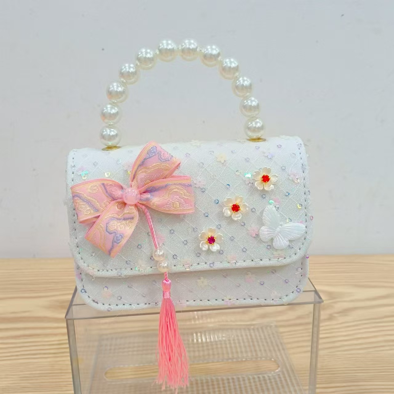 Niños pequeños viento fragrante hombro alto sentido de la chica antigua bolso de cambio princesa perla accesorios de ropa china portátil mochila