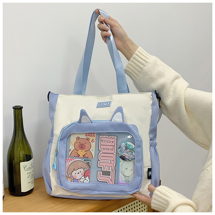 The new cute cartoon printed student bag with a large capacity and transparent student storage single-shoulder bag is selling well for women undefined