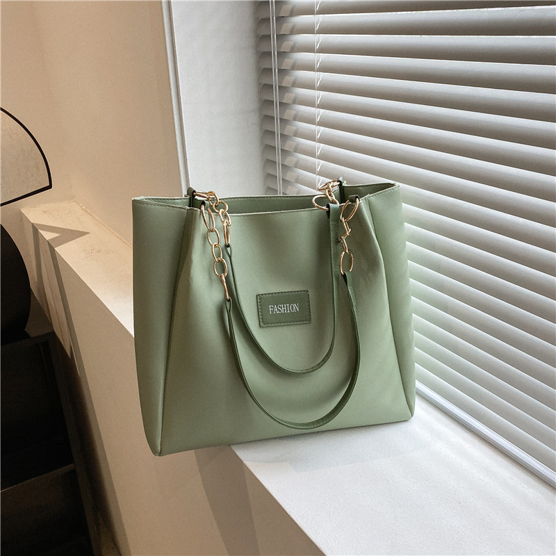 Bolsa de asas de gran capacidad de textura popular de este año para mujeres 2023 nueva moda casual estudiante bolsa de clase bolsa de cercanías