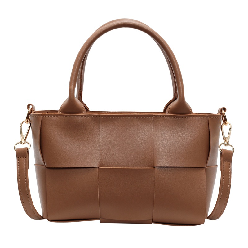 Diseño coreano de nicho de alta sensación portátil bolso de cubo de moda para mujeres 2024 nuevo tejido retro hombro mochila