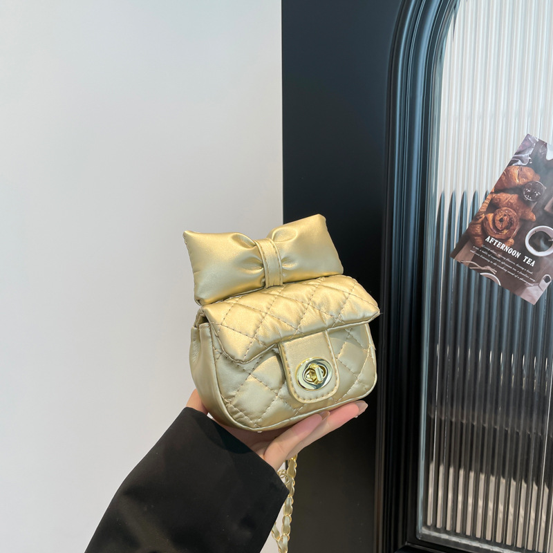 Bolsa de textura 2025 nueva moda extranjera cadena mochila primavera y verano nicho dulce arco mini bolso